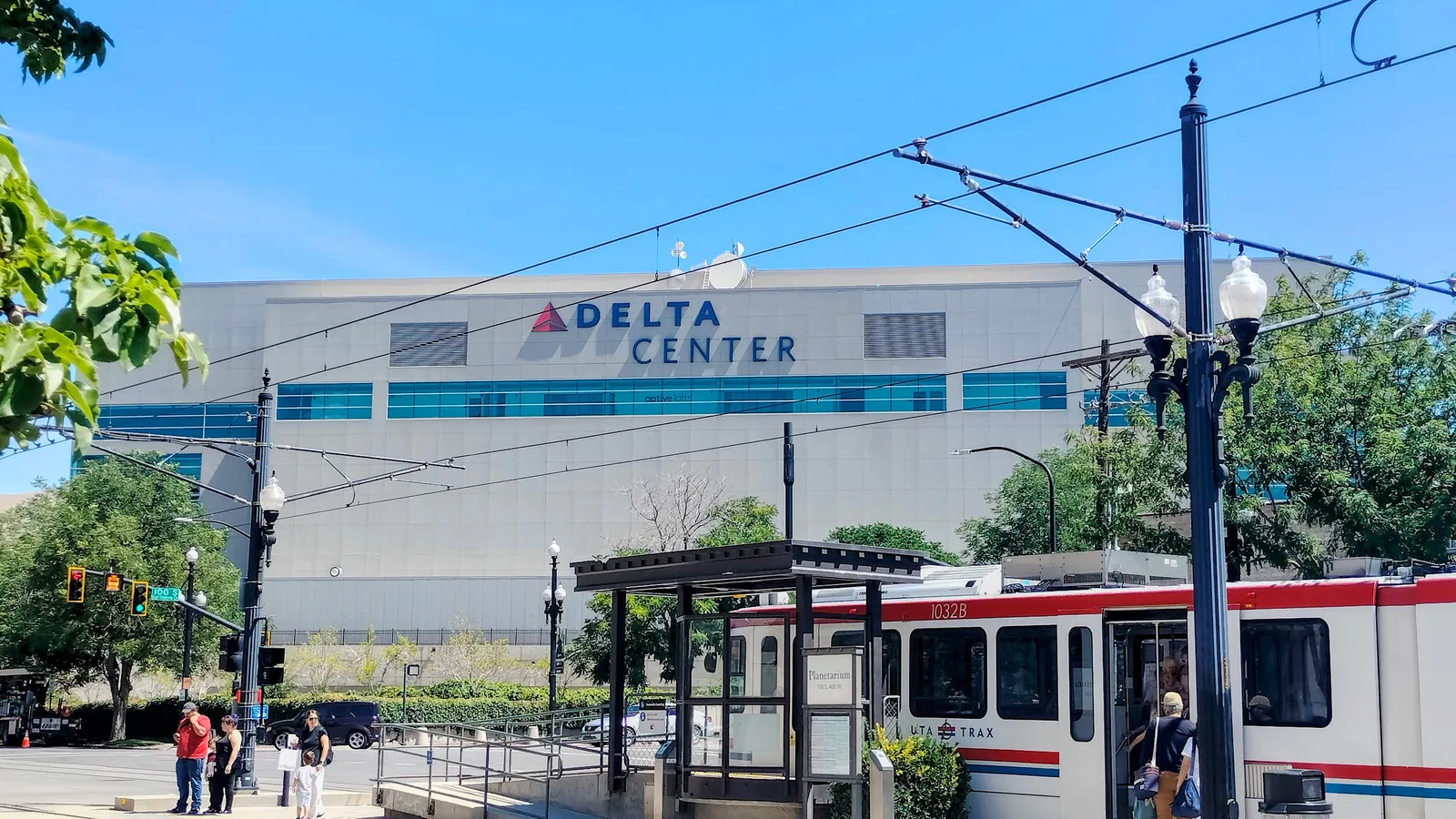 Delta Center exterior and a TRAX train in Salt Lake City